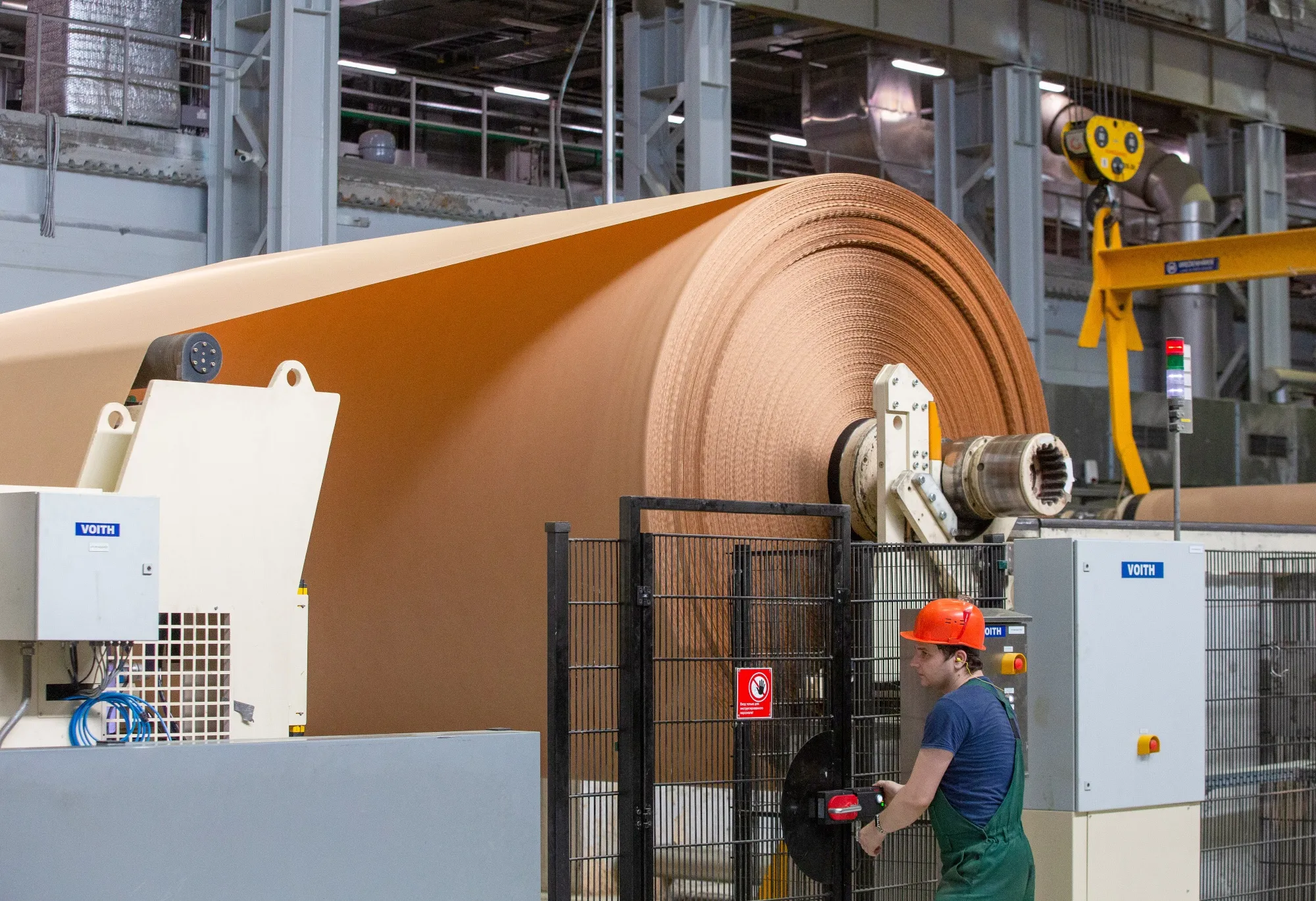 Paper&nbsp;is fed onto a spool at a pulp and paper mill&nbsp;in Segezha, Russia.