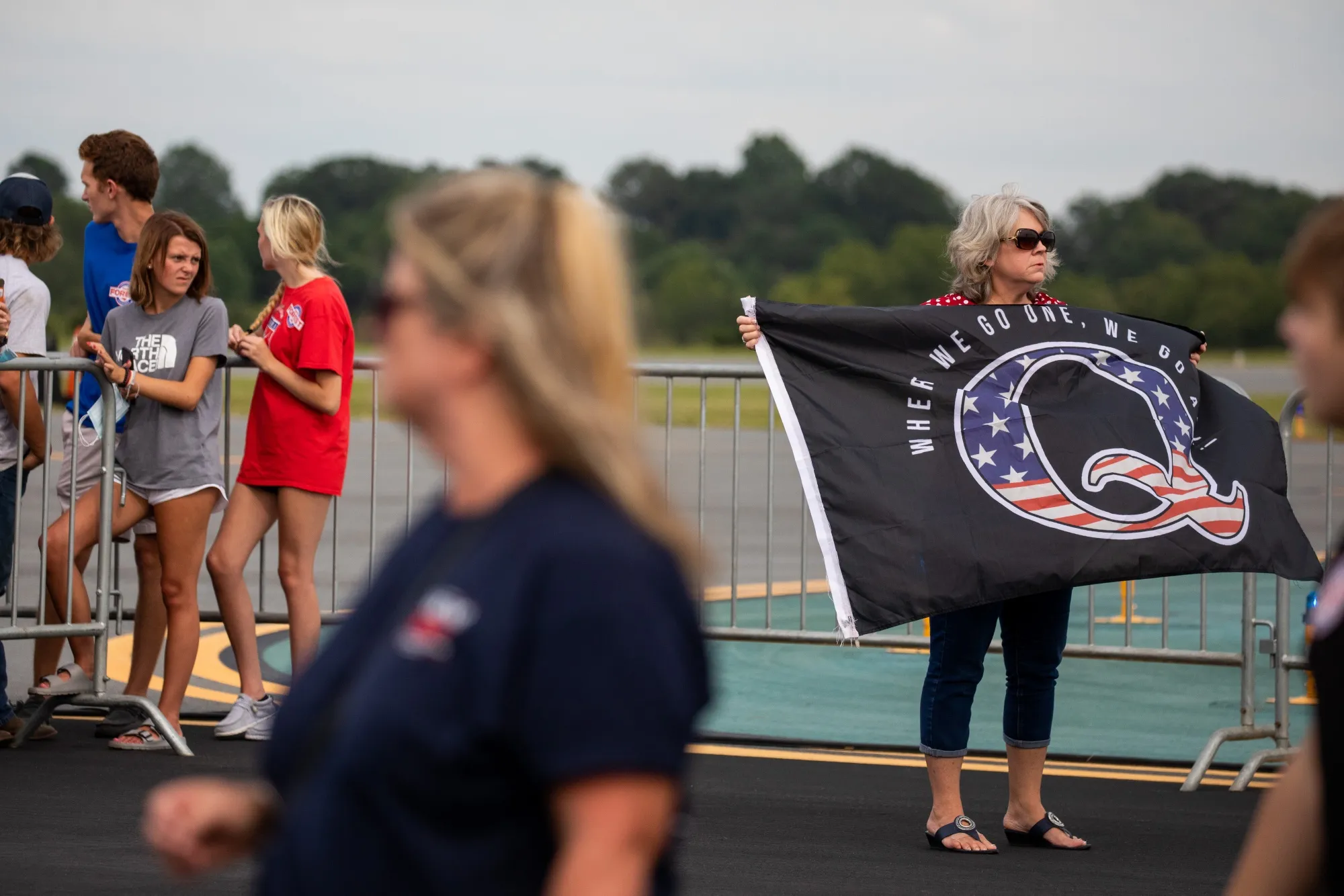 An attendee holds a QAnon flag before a rally for&nbsp;Donald Trump in Winston-Salem, North Carolina&nbsp;in 2020.&nbsp;