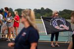 An attendee holds a QAnon flag before a rally for Donald Trump in Winston-Salem, North Carolina in 2020. 