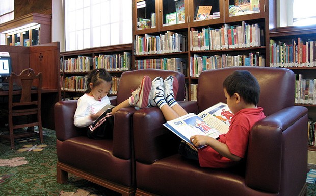 Kids reading (adorably) at a branch of the Los Angeles Public Library, which offered two fee-amnesty weeks in February.