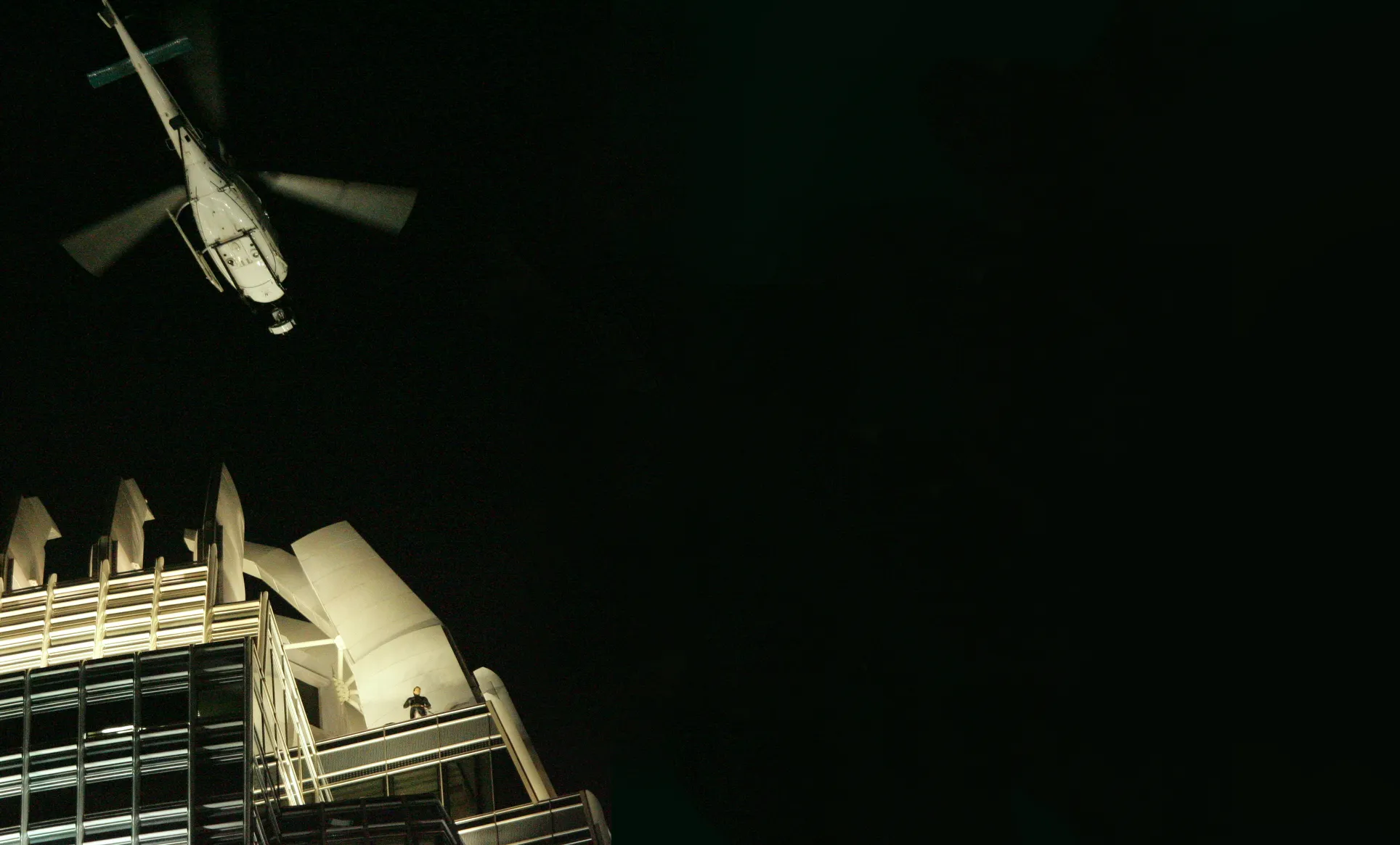 A helicopter flies low while filming for The Dark Knight in Hong Kong’s Central district in 2007.