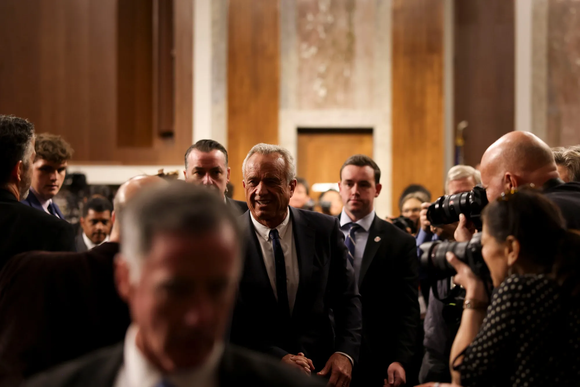 Robert F. Kennedy Jr., center, departs his confirmation hearing on Jan. 29.