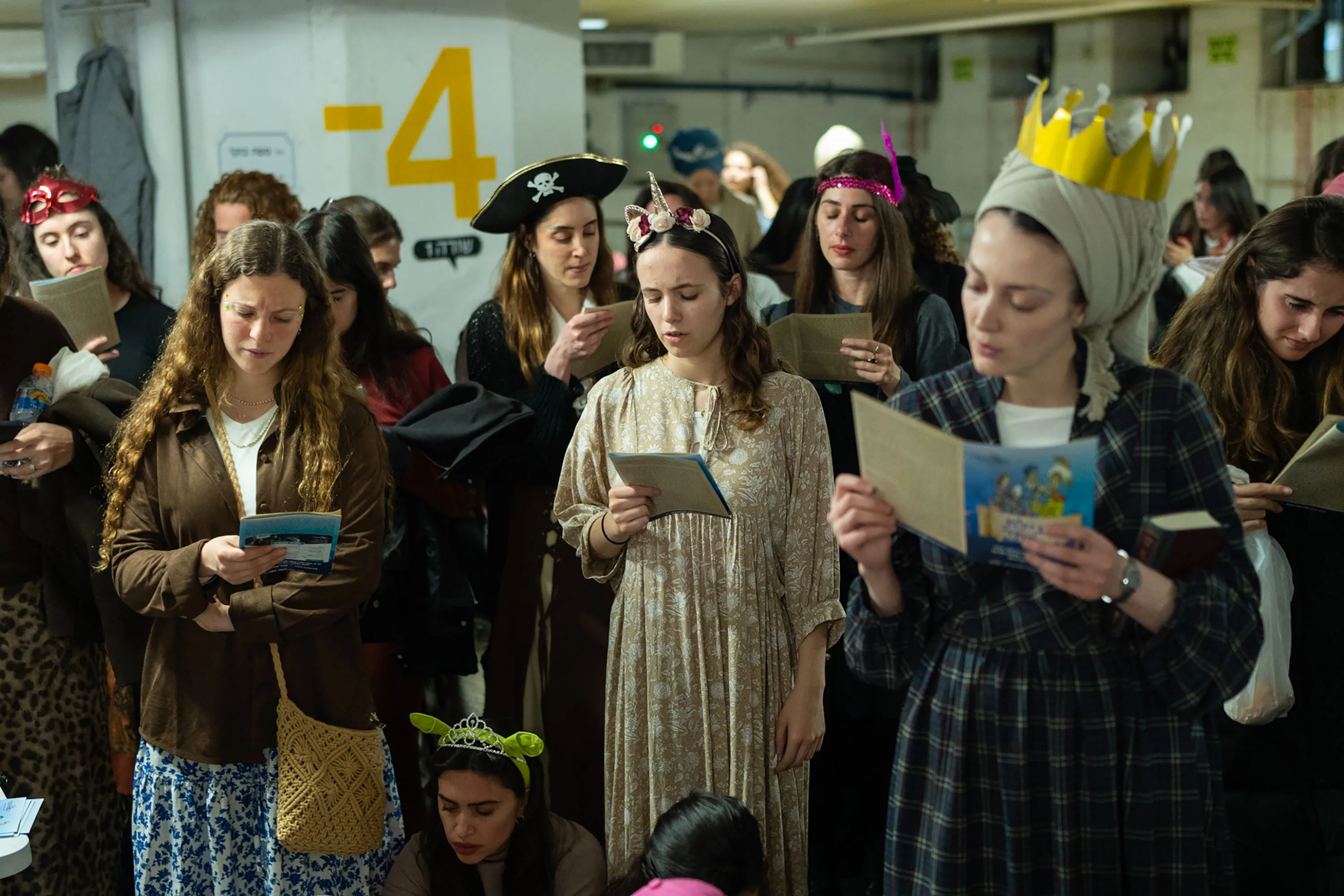 A reading to mark Purim in an underground parking garage.&nbsp;&nbsp;