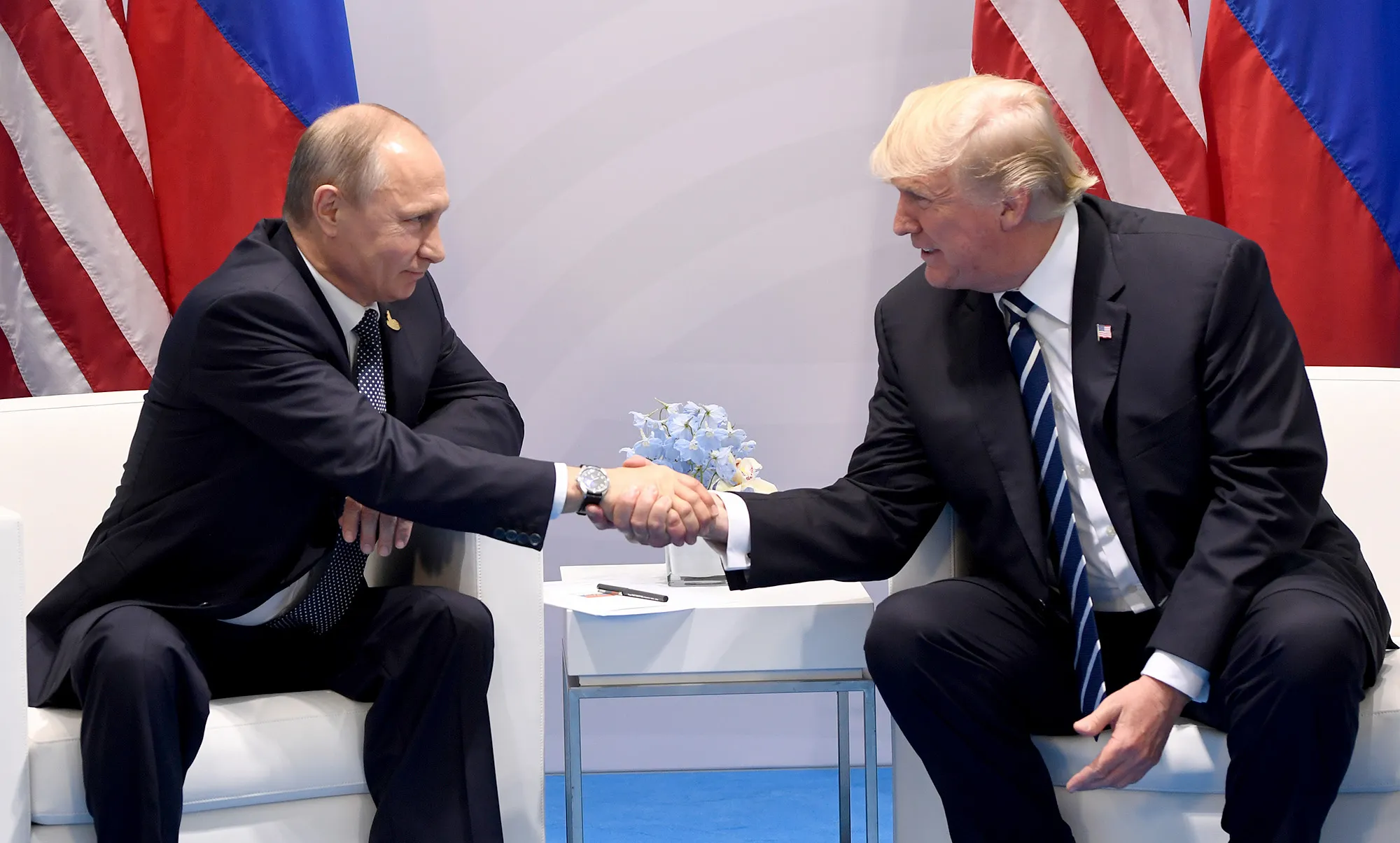 Vladimir Putin and Donald Trump shake during a meeting on the sidelines of the G20 Summit in Hamburg on July 7, 2017.