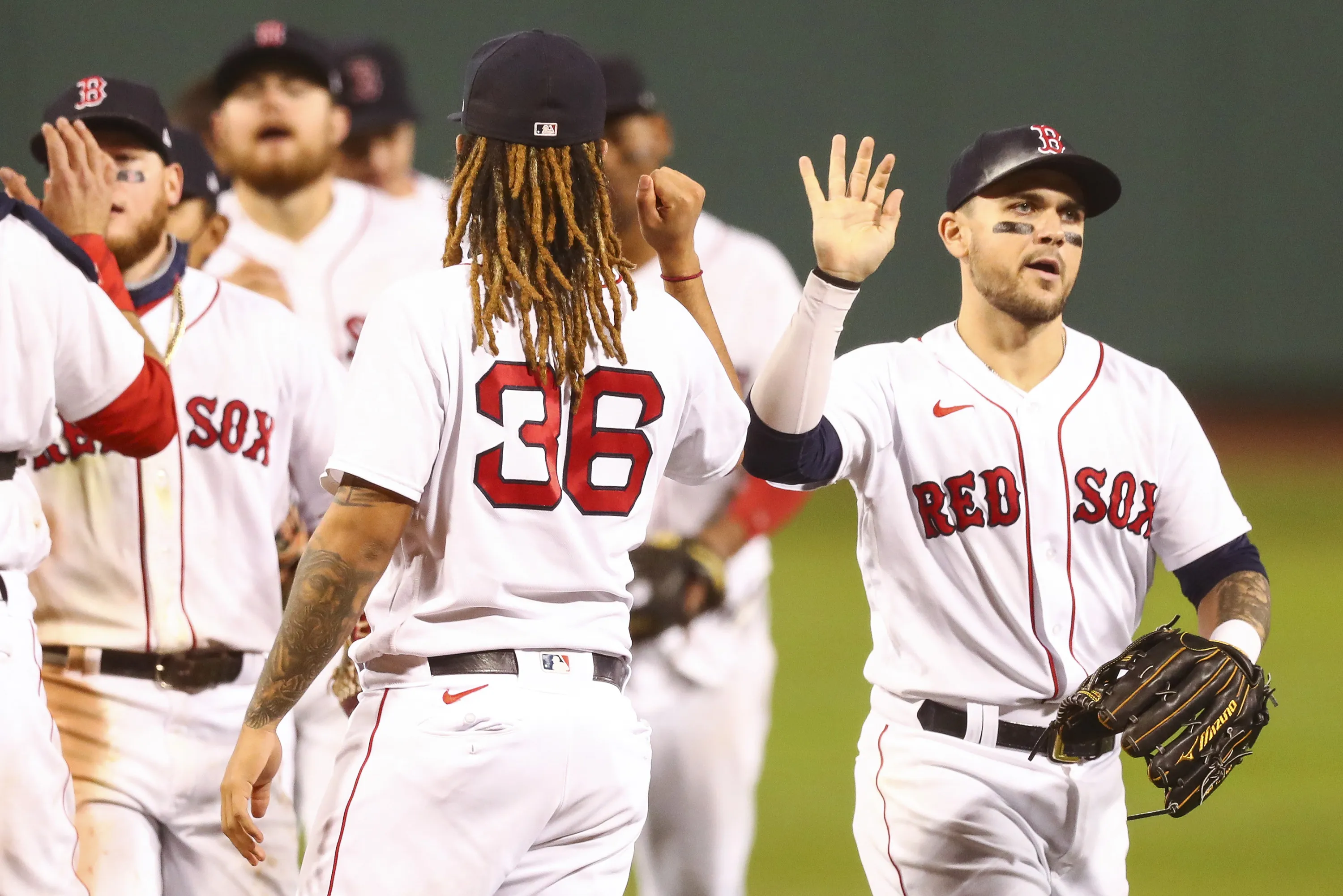 The Boston Red Sox celebrate after a victory over the Baltimore Orioles at Fenway Park in Boston, Massachusetts, on Sept. 23.