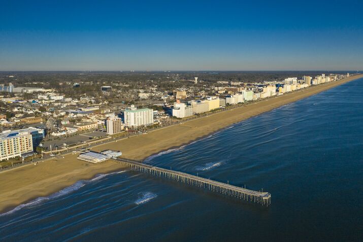 Aerial drone view of Virginia Beach Skyline and Fishing Pier with  Atlantic Ocean, Virginia