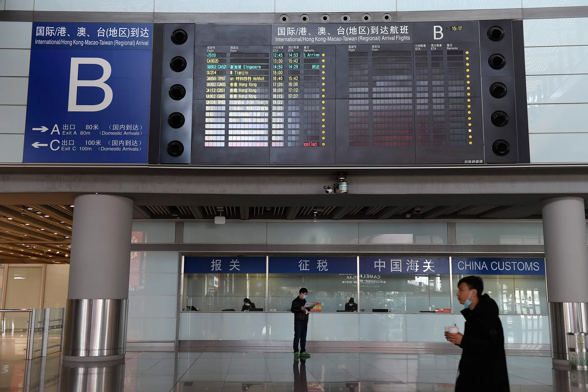 A board showing international&nbsp;arrivals in the near empty arrivals area in Beijing Capital Airport on March 27.