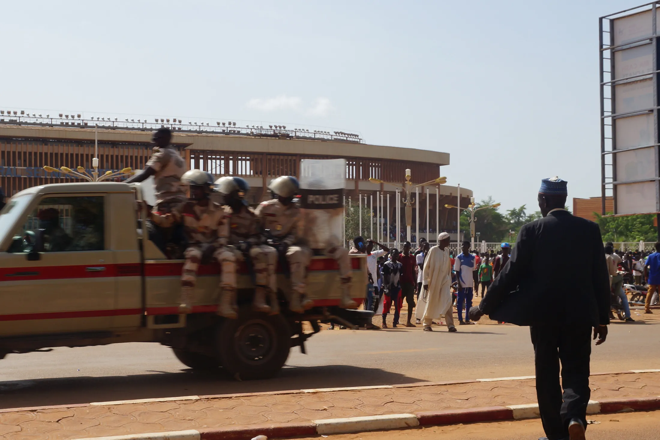 Civilians gather to join the Army in front of the stadium as recruitment for a civilian militia force called the Volunteers for the Defense of Niger (VDN) commenced in Niamey, Niger on Aug. 19.