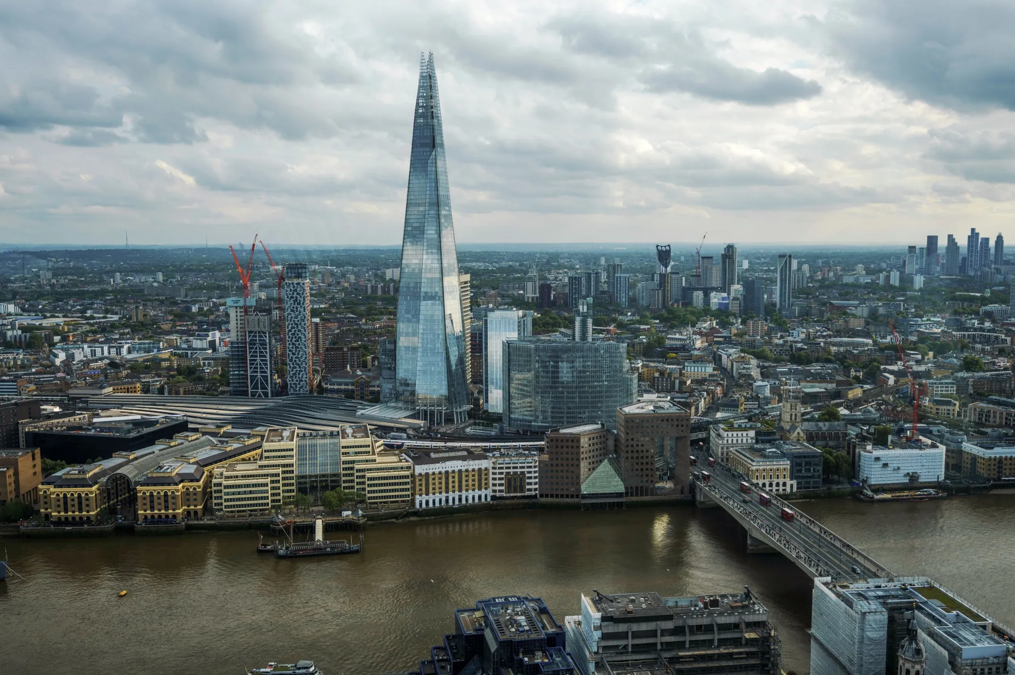 The Shard skyscraper, London bridge and River Thames looking south from the city financial district in London.