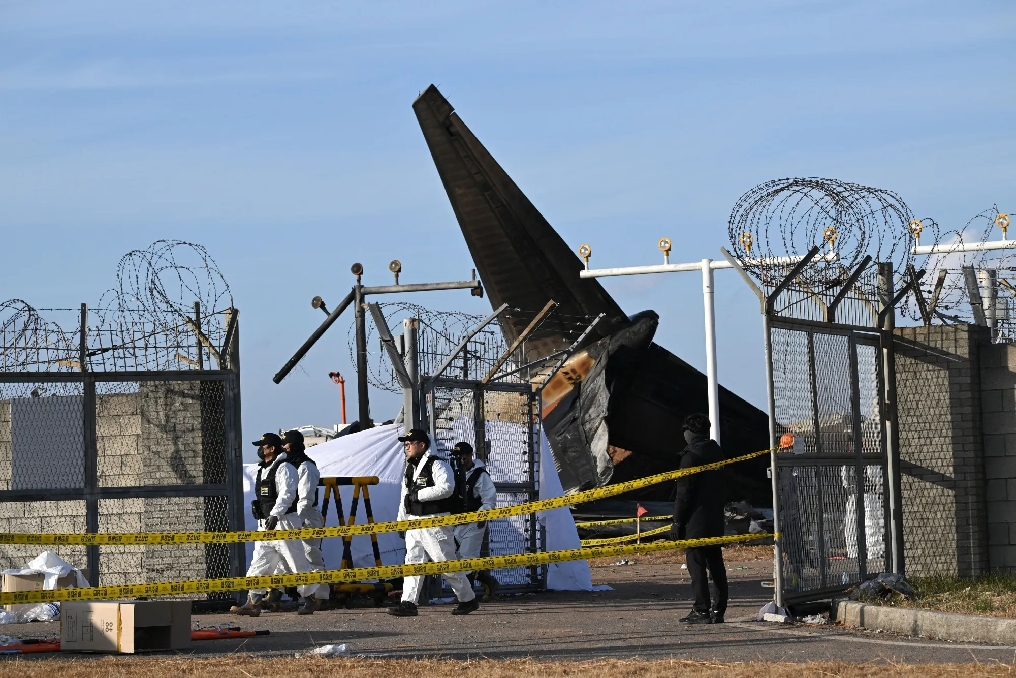 Recovery teams work at the scene of the&nbsp;Jeju Air Boeing 737-800 crash&nbsp;in Muan, South Korea.