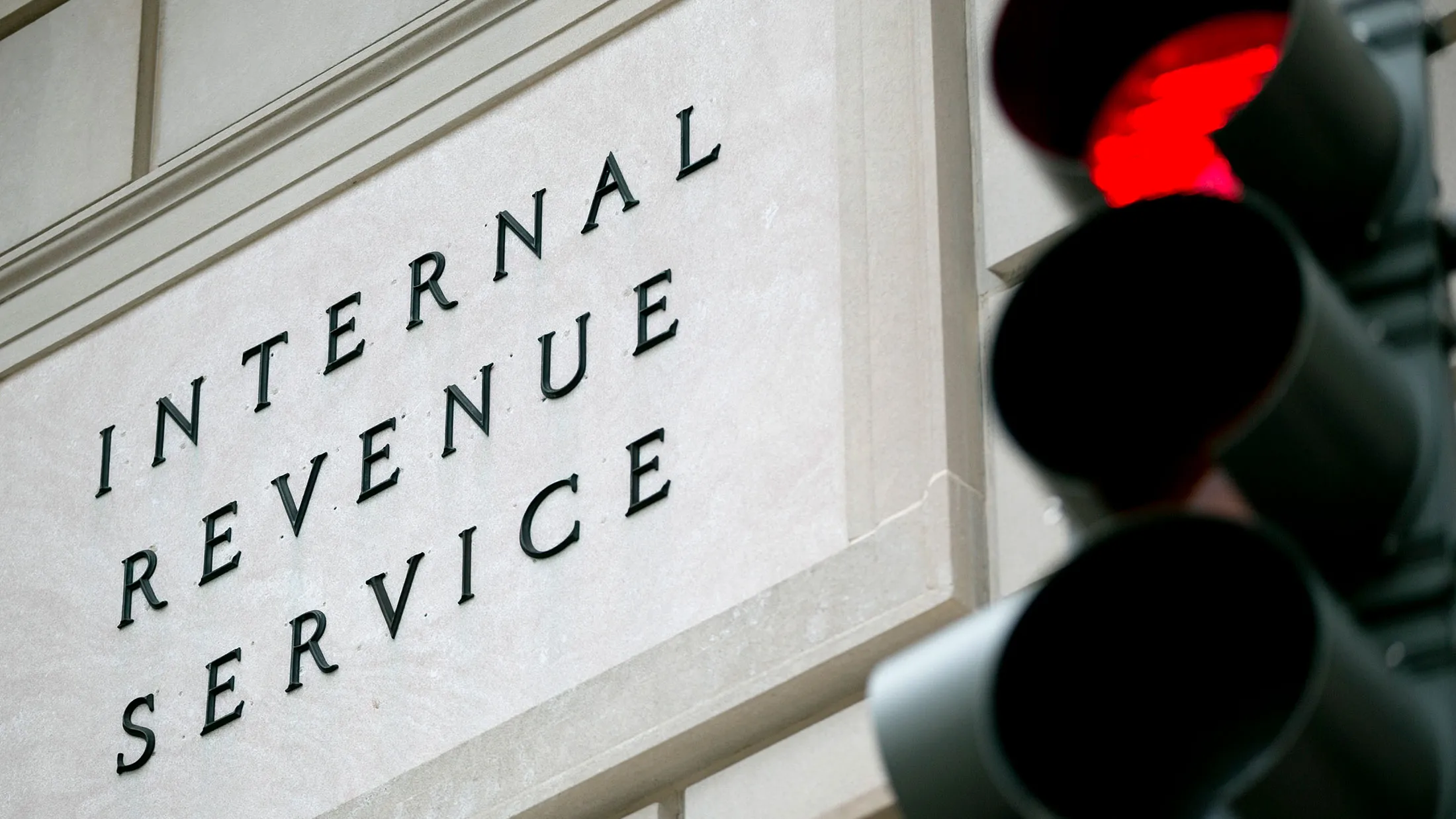 A red stoplight stands in front of the Internal Revenue Service (IRS) headquarters in Washington on May 15, 2013.
