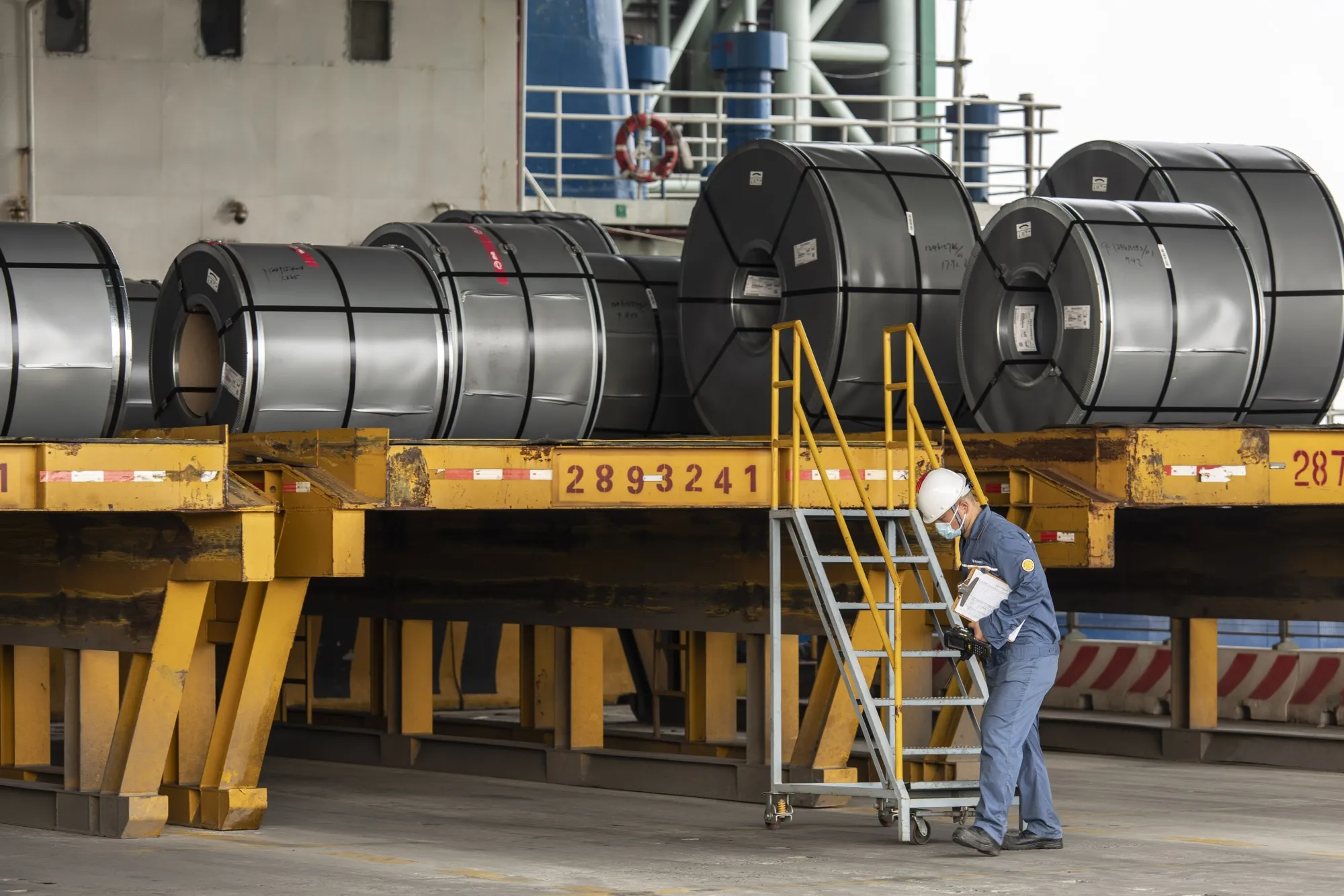Rolls of steel on the transport wharf at a production facility in Shanghai, China.