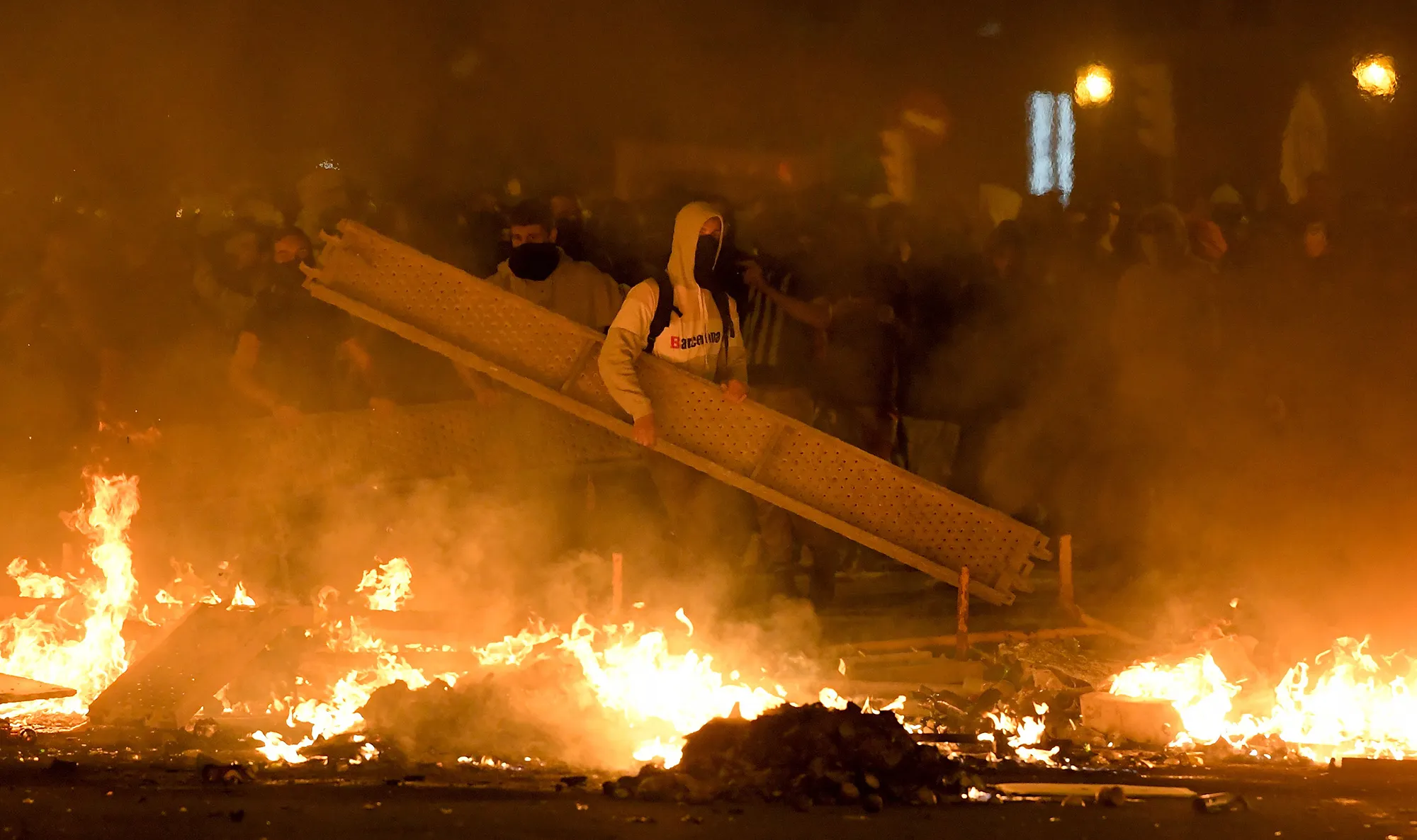 Protesters make barricades during a demonstration in Barcelona on Oct. 16.