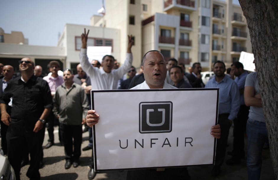 Uber drivers have long protested working conditions. Here, drivers demonstrate outside Uber's Santa Monica office in 2014.