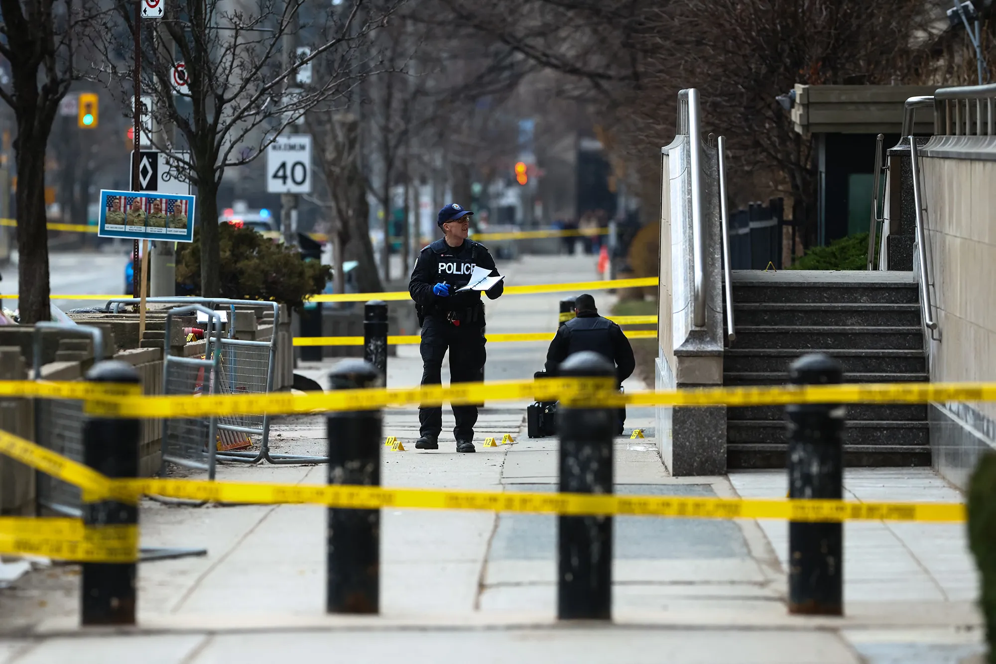 Police work at the scene of a shooting at the US Consulate in Toronto on March 10.