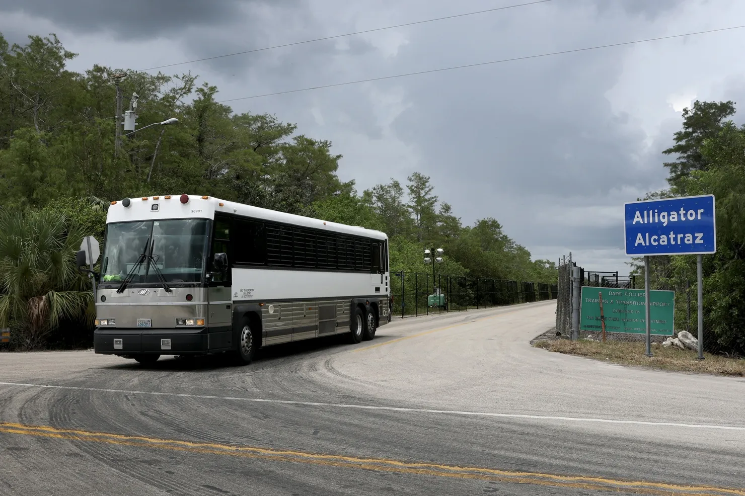 A bus exits from "Alligator Alcatraz" at tthe Dade-Collier Training and Transition Airport in Ochopee, Florida, on July 10.