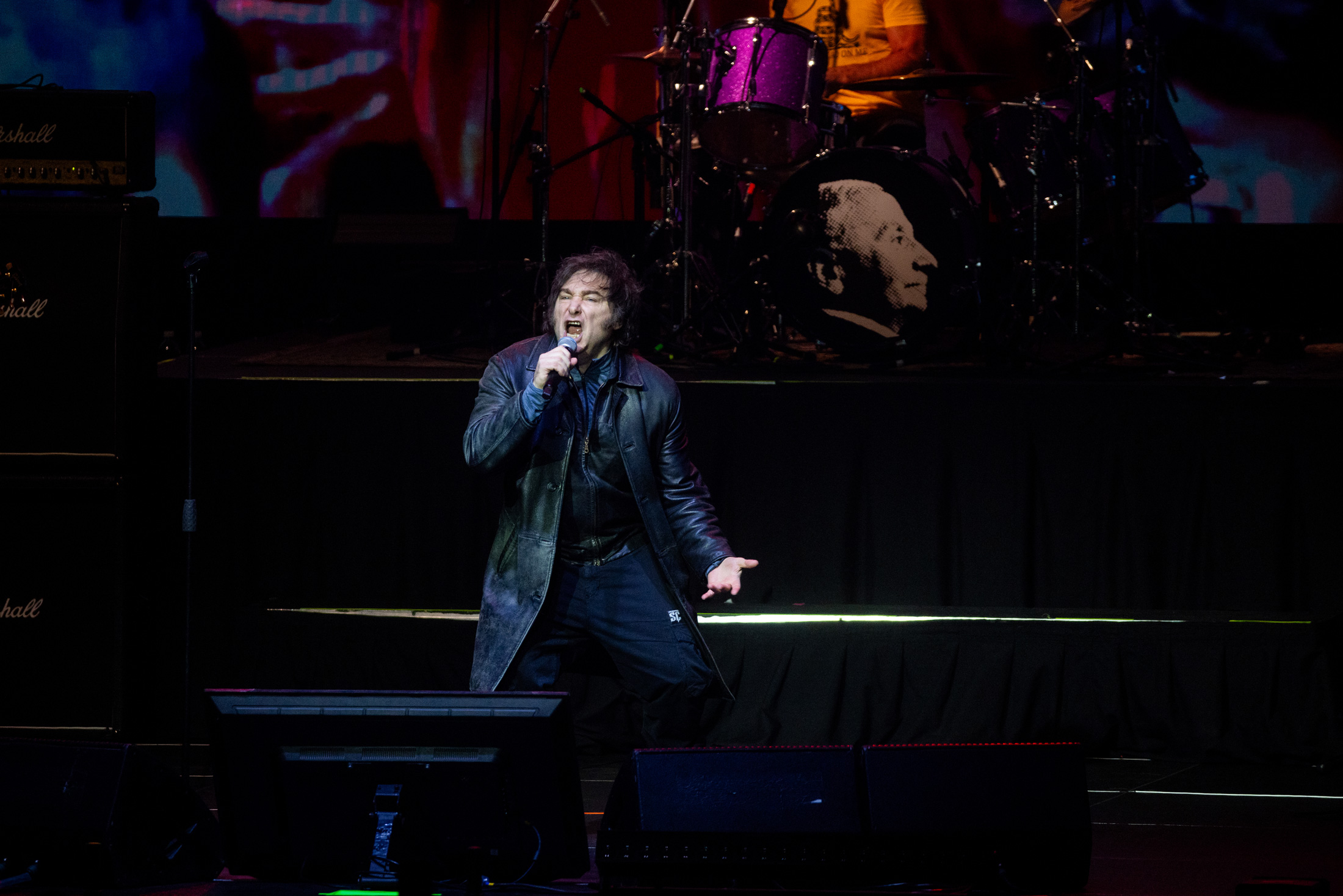 President Javier Milei sings with a band during the presentation of his book 'La Construccion del Milagro' at an arena in Buenos Aires. Photographer: Tomas Cuesta/Getty Images