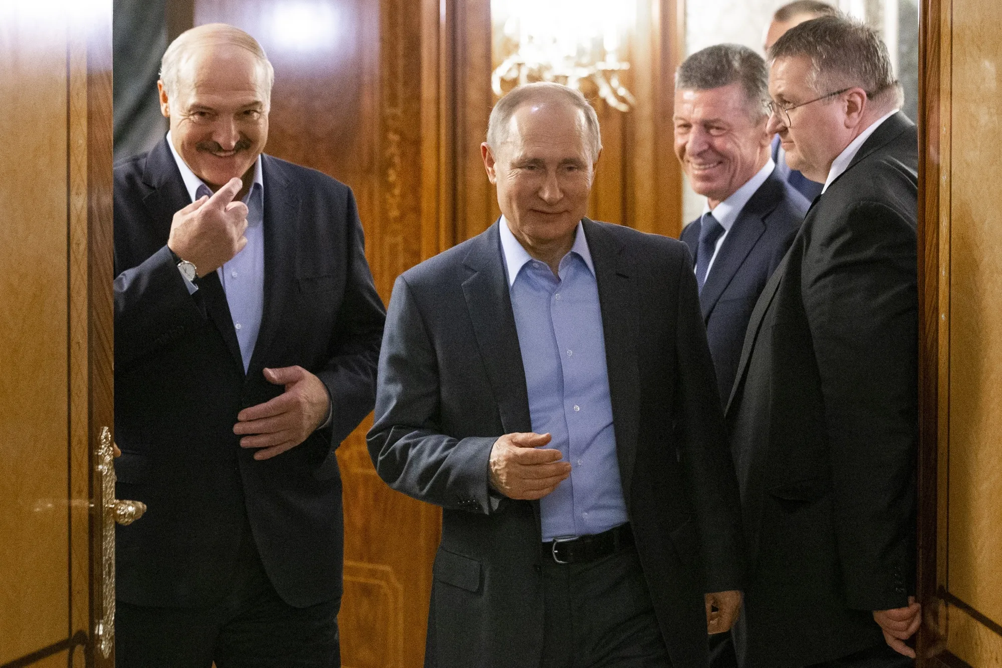 Vladimir Putin, center, and&nbsp; Alexander Lukashenko, left, in Sochi, Russia. on Feb.&nbsp;21.