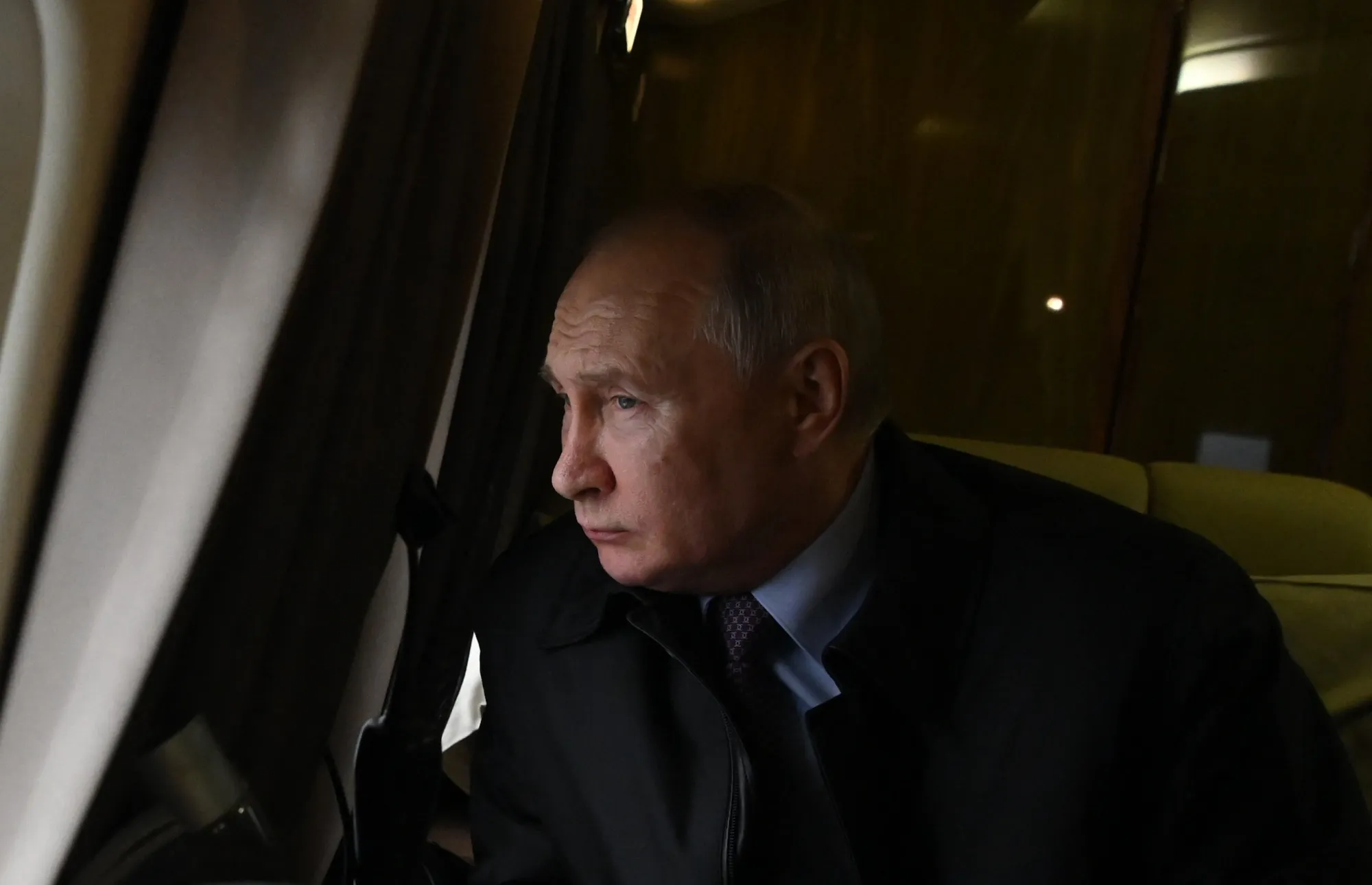 Vladimir Putin rides in a helicopter in Murmansk region, Russia, on July 20.