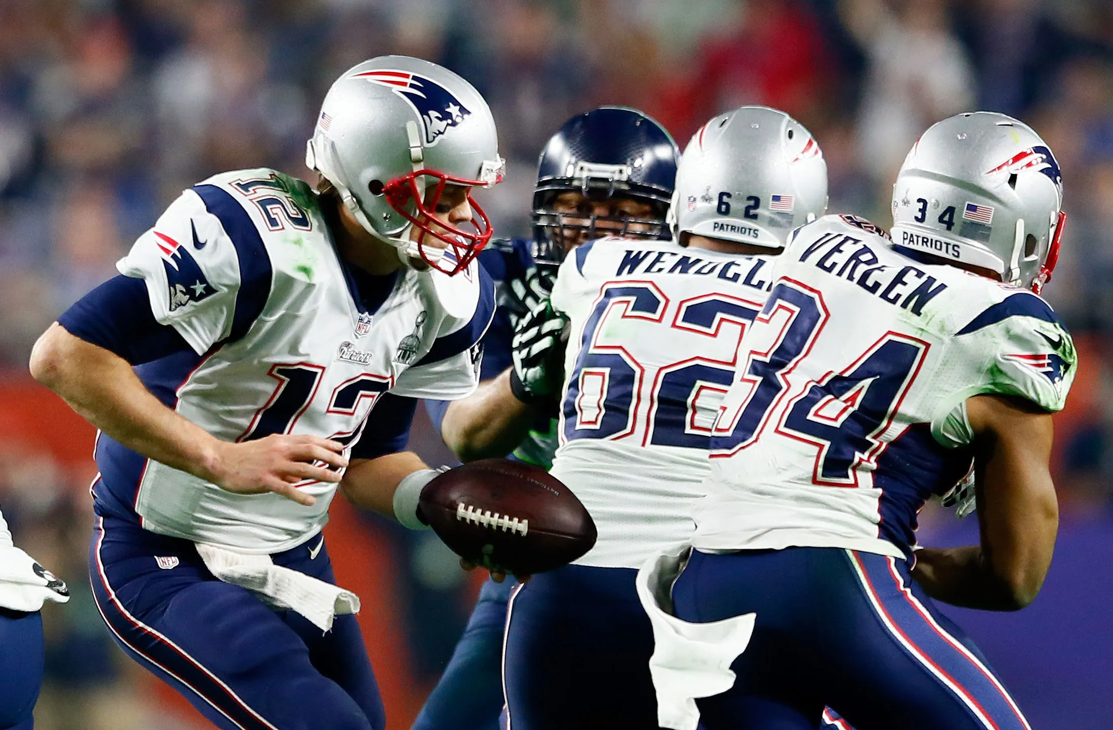 Brady, left, fakes a handoff as the Patriots face the Seattle Seahawks in the Super Bowl XLIX in February.
