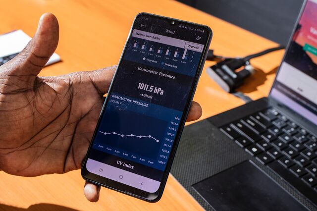 Senior Meteorological Technician Lerone Lynch shows barometric pressure and other weather data on his phone at the Meteorological Service of Jamaica offices in Kingston, Jamaica on September 11, 2024.