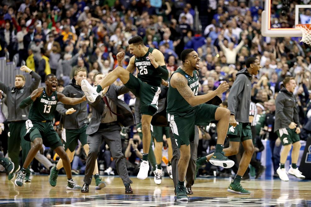Nick Ward, right, and Kenny Goins, left, of the Michigan State Spartans celebrate their teams 68-67 win over the Duke Blue Devils in the East Regional game of the 2019 NCAA Men's Basketball Tournament on March 31.