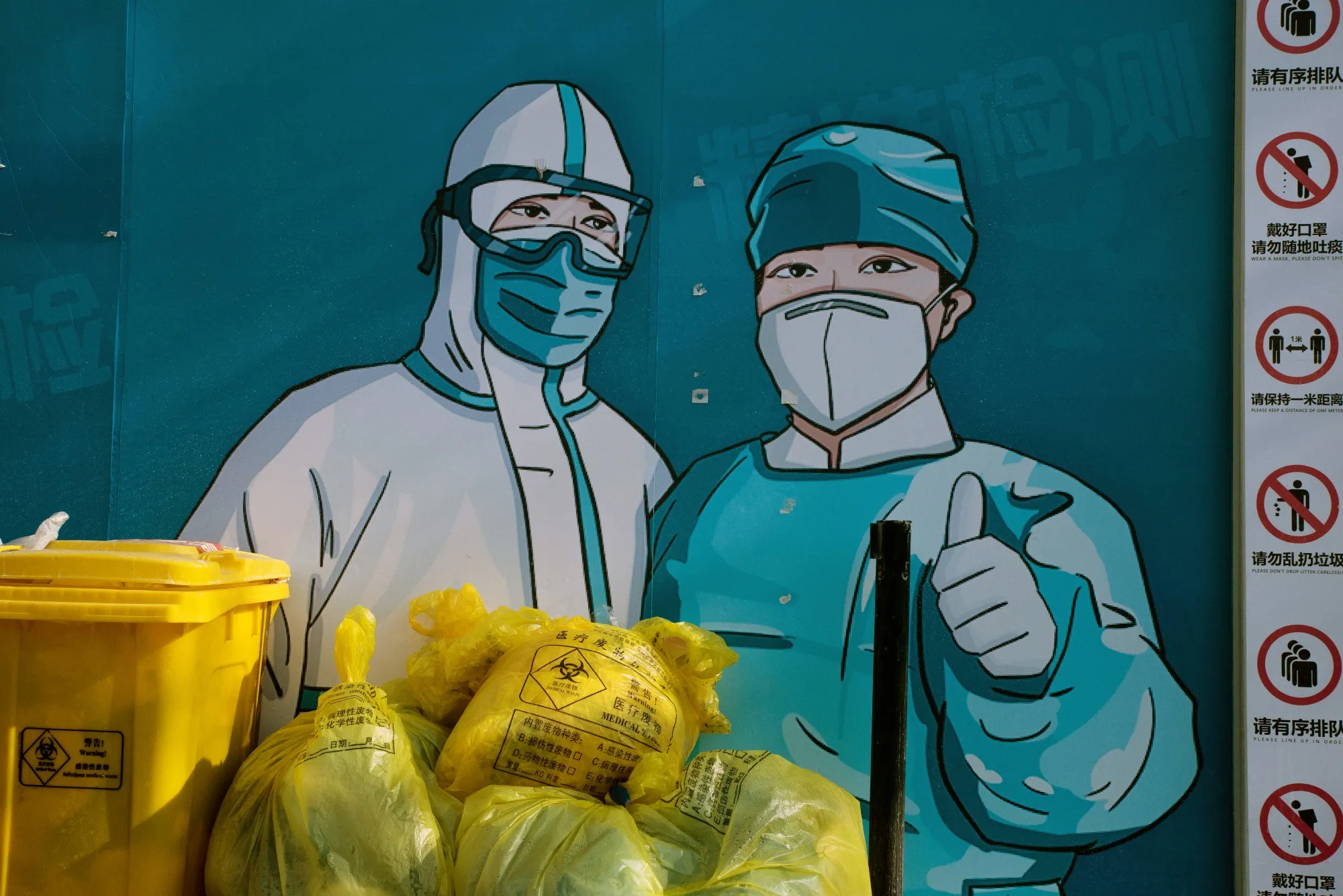 A mural of health workers in protective gear&nbsp;in Beijing on Dec. 6.