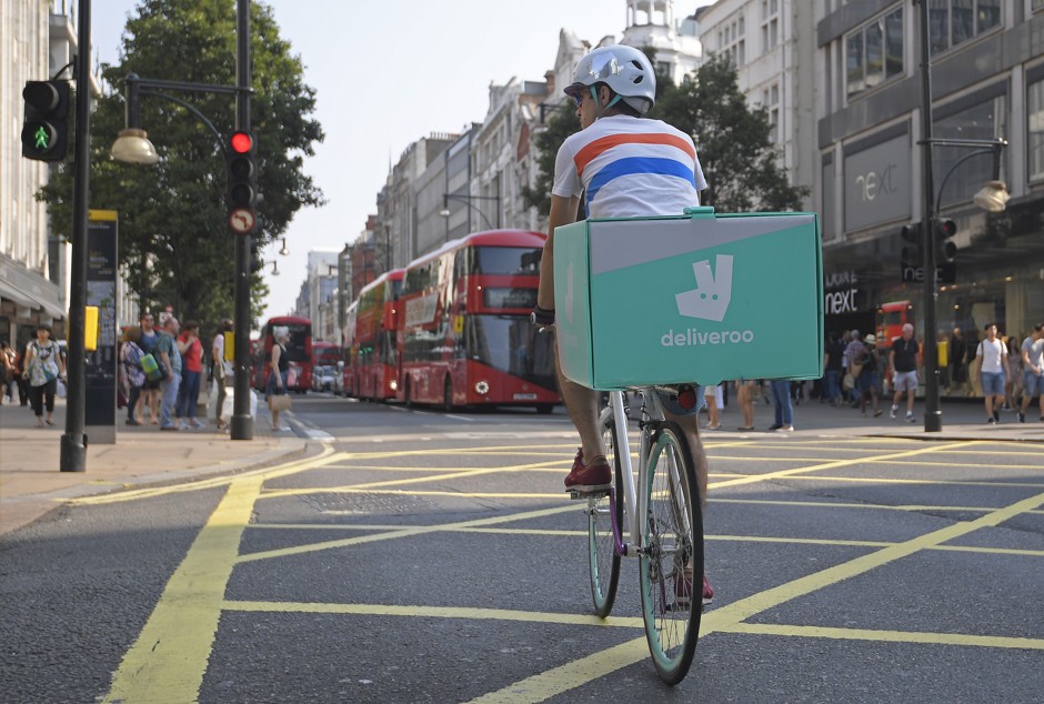 A cyclist delivers food for Deliveroo in London. 