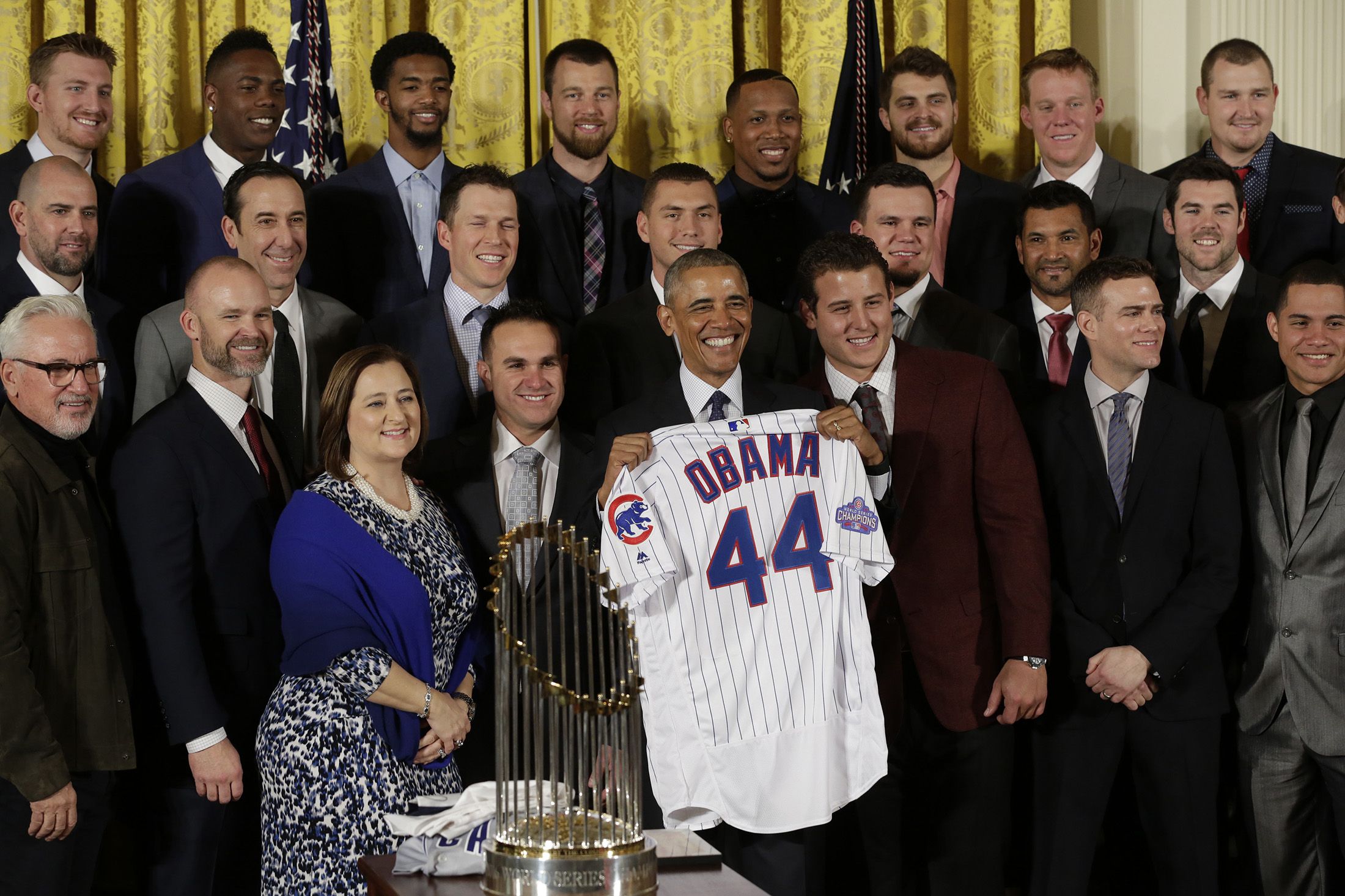 US President Barack Obama poses with presented jersey as he welcomes the World Champion Chicago Cubs baseball team to the White House in Washingto, DC on January 16, 2017.
