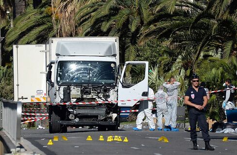 Police secure the area around the truck in Nice on July 15.