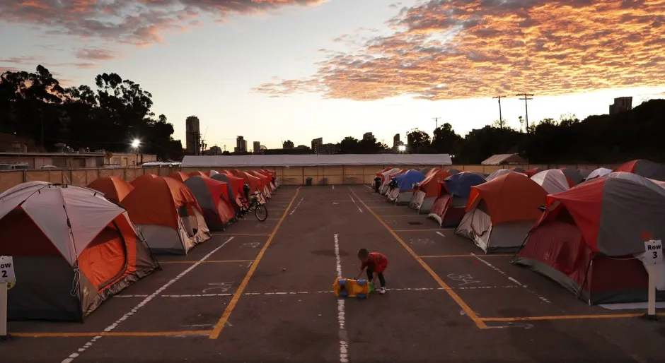 A child plays in a city-sanctioned encampment for homeless families in San Diego. 