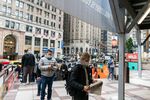 Voters wearing protective masks stand in line to cast ballots at an early voting polling location for the 2020 Presidential election at Madison Square Garden in New York, U.S., on Monday, Oct. 26, 2020.