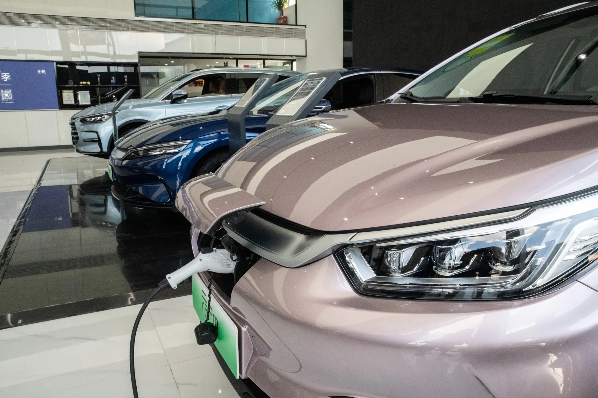 BYD Co. Dynasty series electric vehicles at a dealership in Beijing, China.