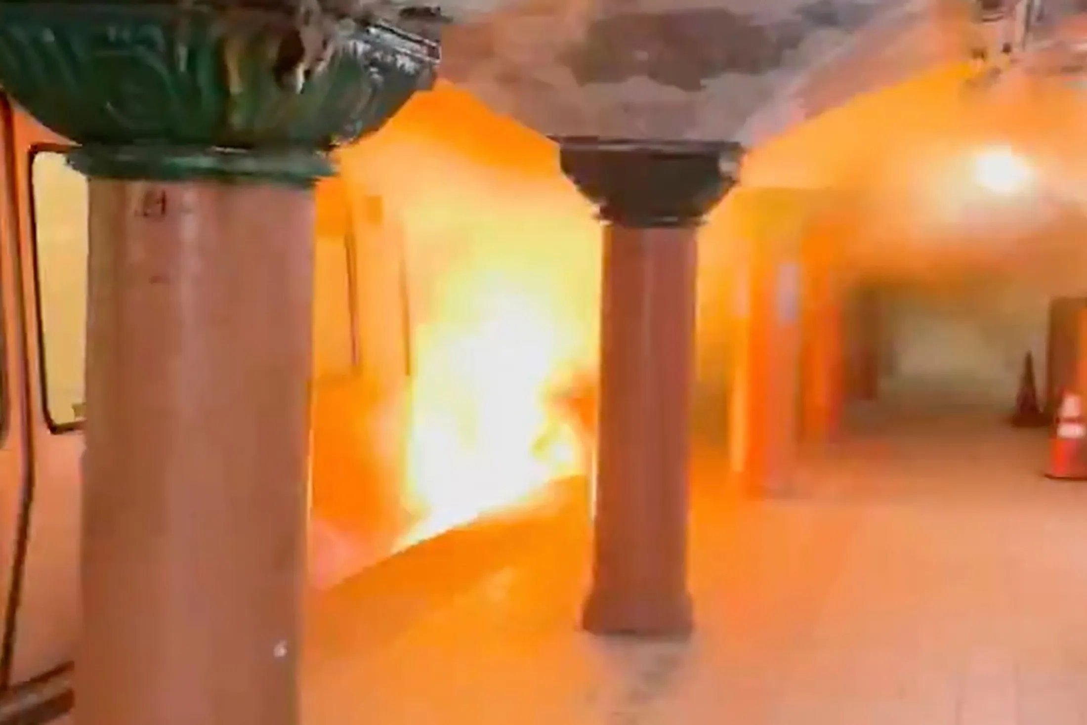Flames rising nearly to the top of a Port Authority Trans-Hudson (PATH) train car at the Newport station in Jersey City, New Jersey, on&nbsp;Aug. 4.