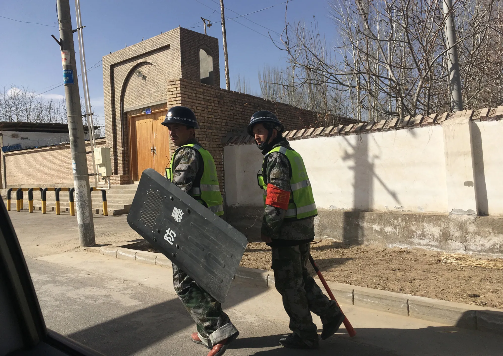 Police patrol&nbsp;a village&nbsp;in China's western Xinjiang region on Feb. 17, 2018.
