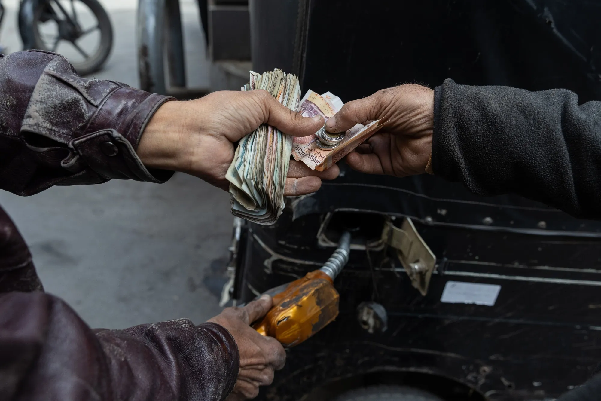 A customer pays for fuel&nbsp;at a CPC-Egypt gas station in Cairo on March 11.