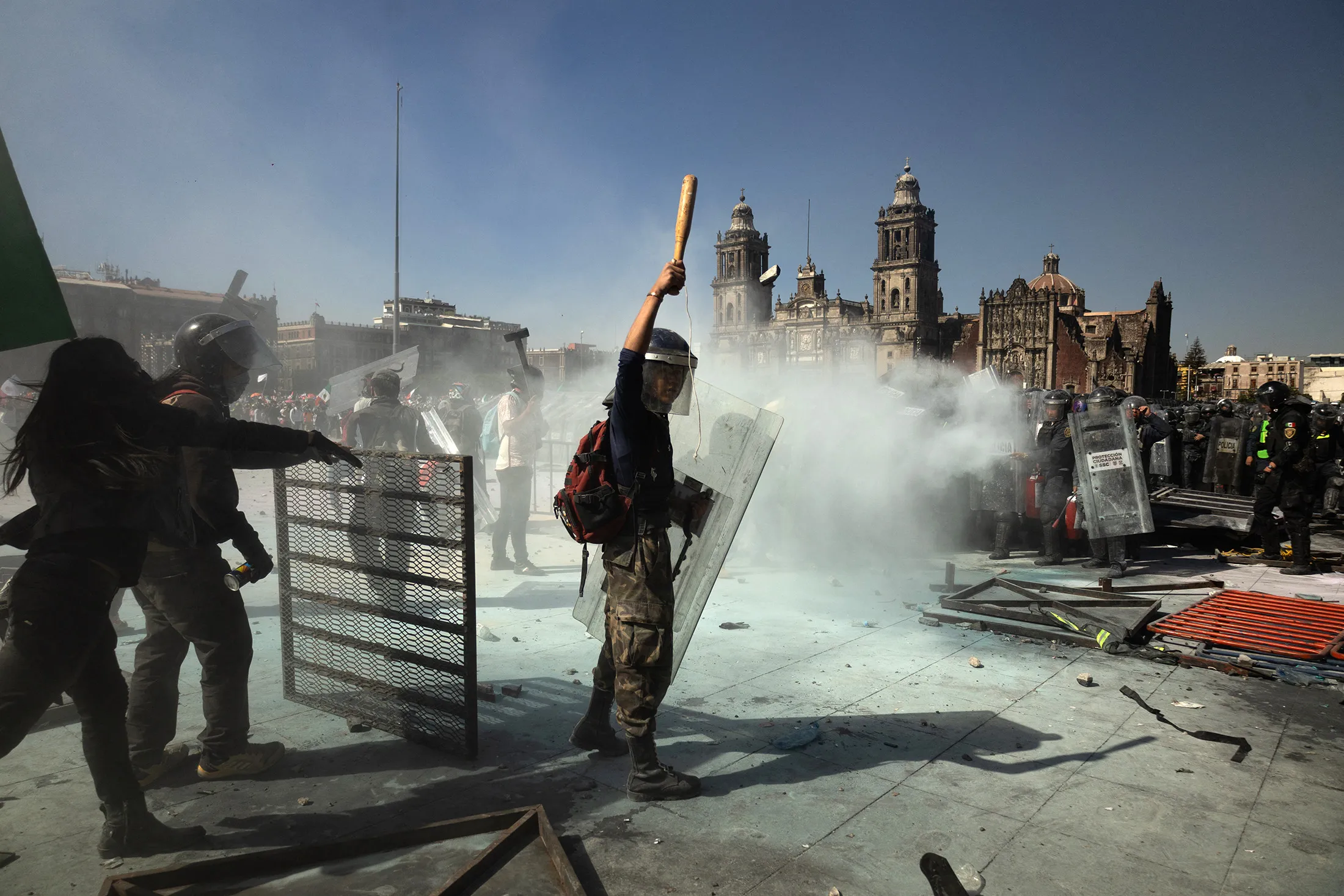 Demonstrators clash with riot police during an anti-government protest at Zocalo Square in Mexico City on Nov.&nbsp;15.