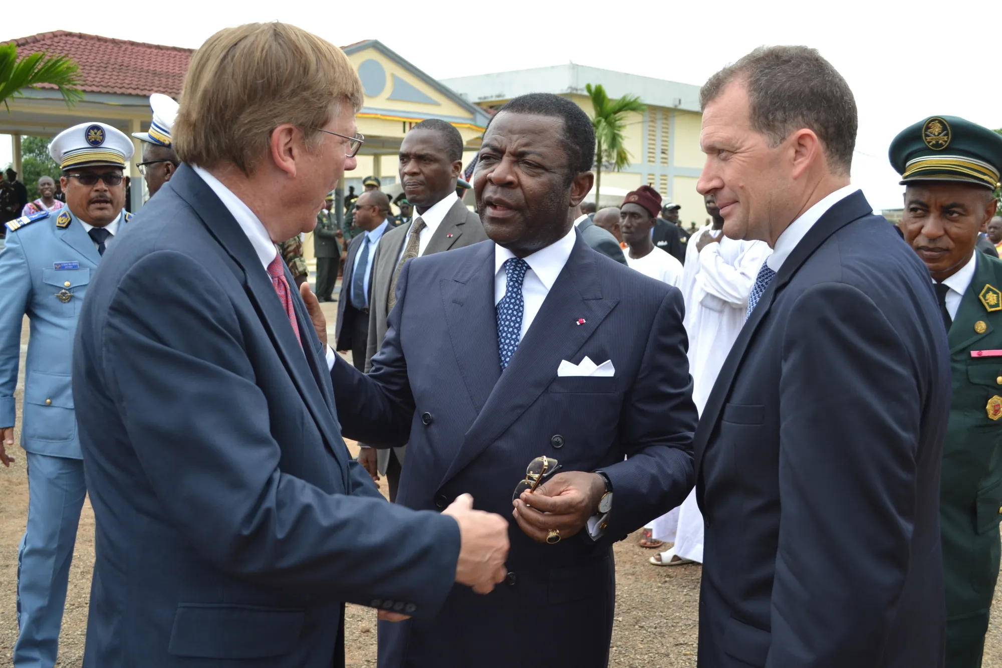 Tim Watters with the Cameroon minister of defense and the U.S. ambassador to Cameroon, upon delivery of 163 pieces of equipment.
