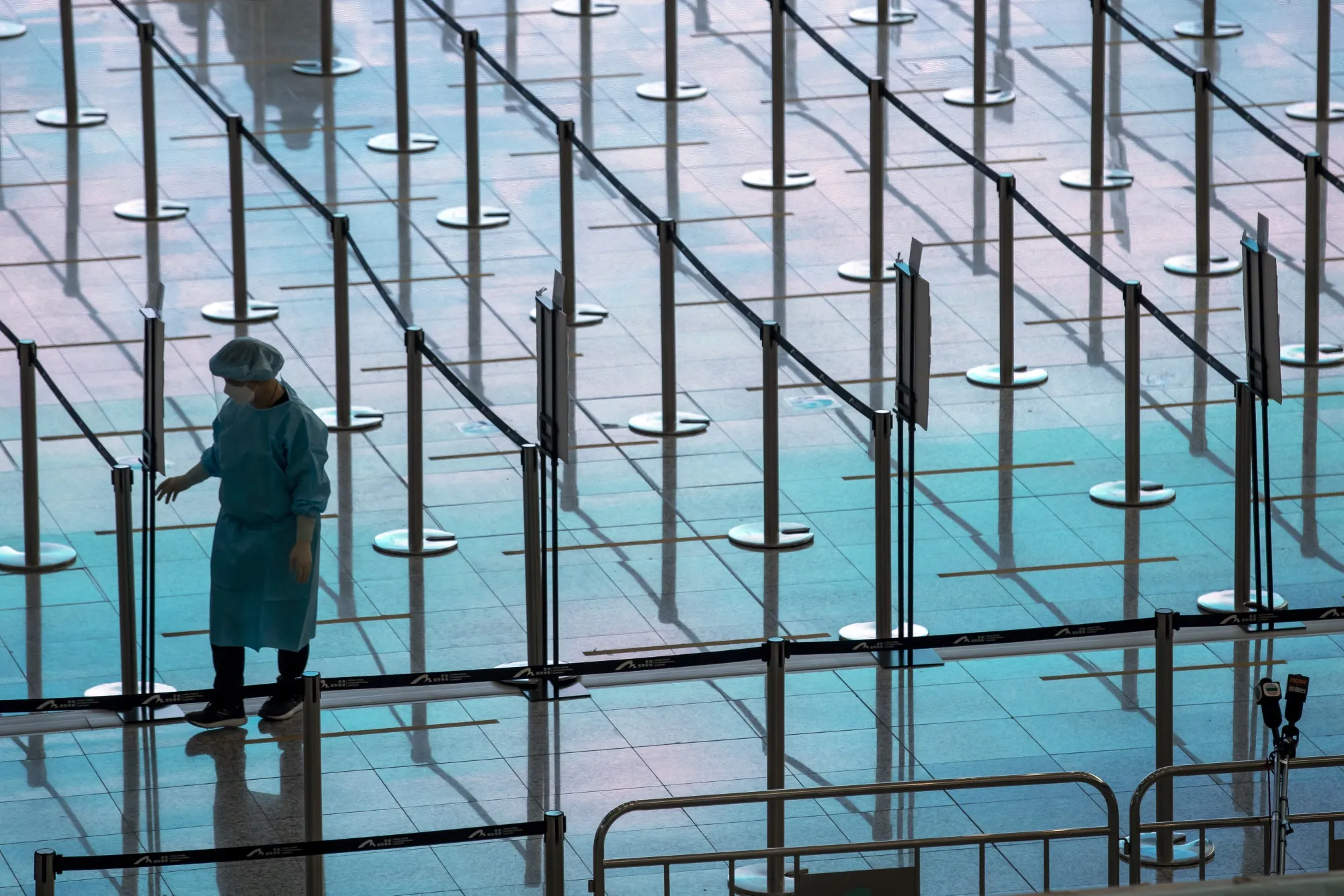 A healthcare worker in an area for travelers at&nbsp;Hong Kong International Airport earlier in April.