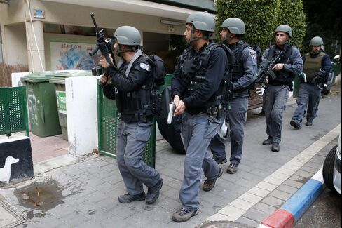Israeli security forces search the area following the attack