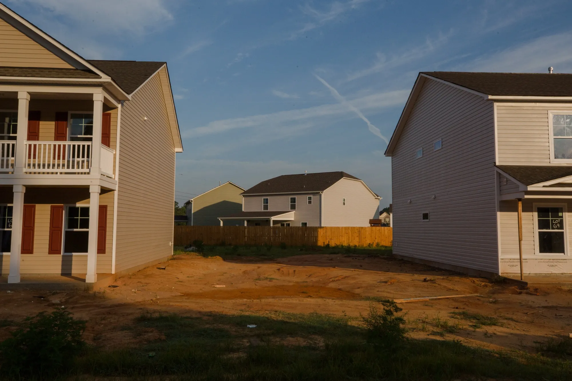 A finished home between two homes under construction&nbsp;in Sumter, South Carolina.