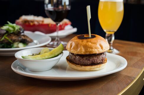 A tender cheeseburger with melted raclette.