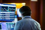A trader works on the floor of the New York Stock Exchange.