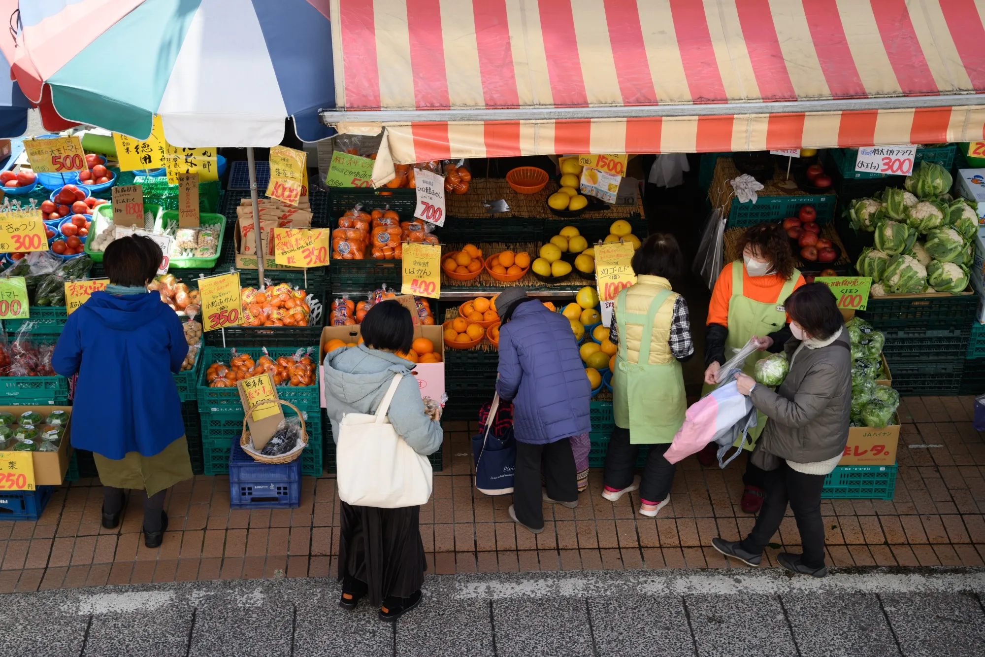 Customers at a store in Kawasaki, Japan. The yen’s weakness may add to shoppers’ woes via higher import costs for energy and food.&nbsp;