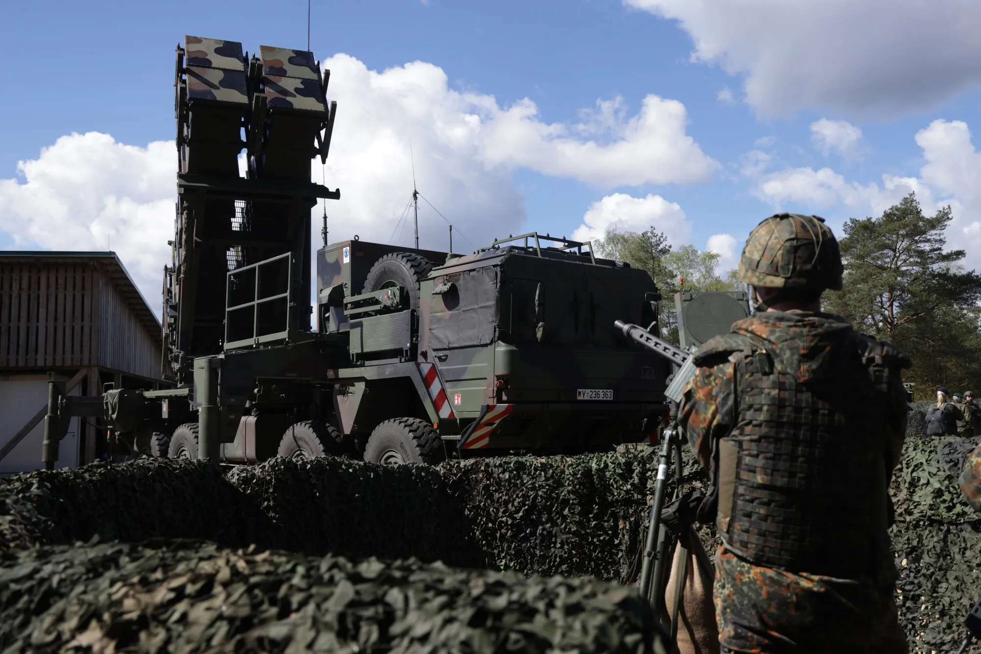 A soldier surveys a Patriot missile system in Munster, Germany.