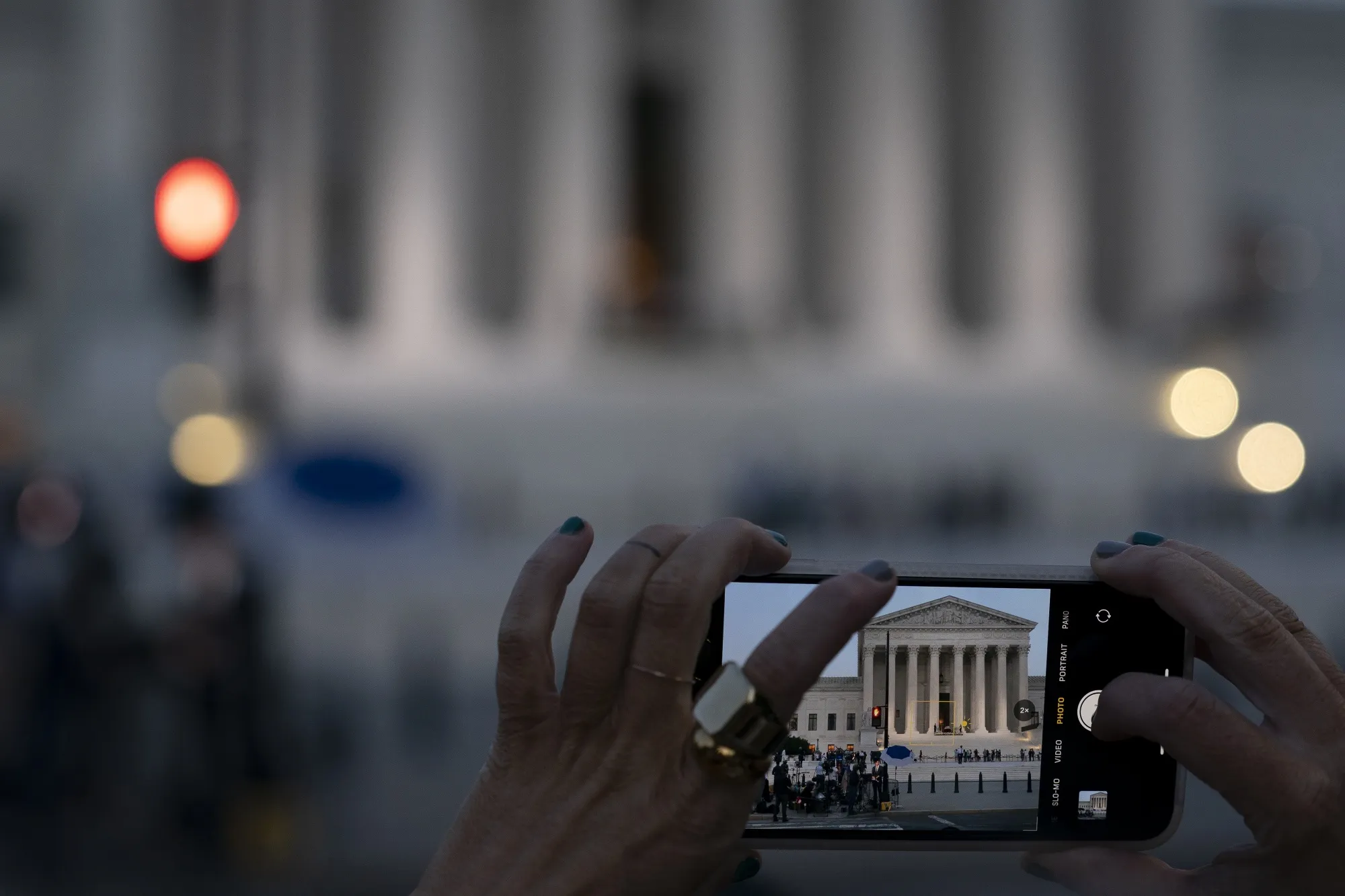 A visitor takes a photograph of the&nbsp;Supreme Court in Washington, DC.