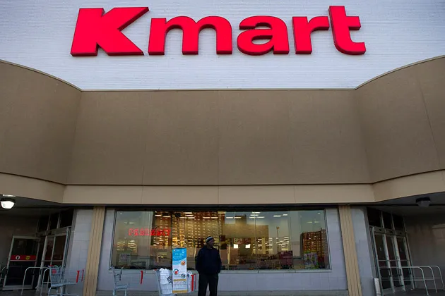 A shopper stands outside a Kmart store in the Bronx, New York