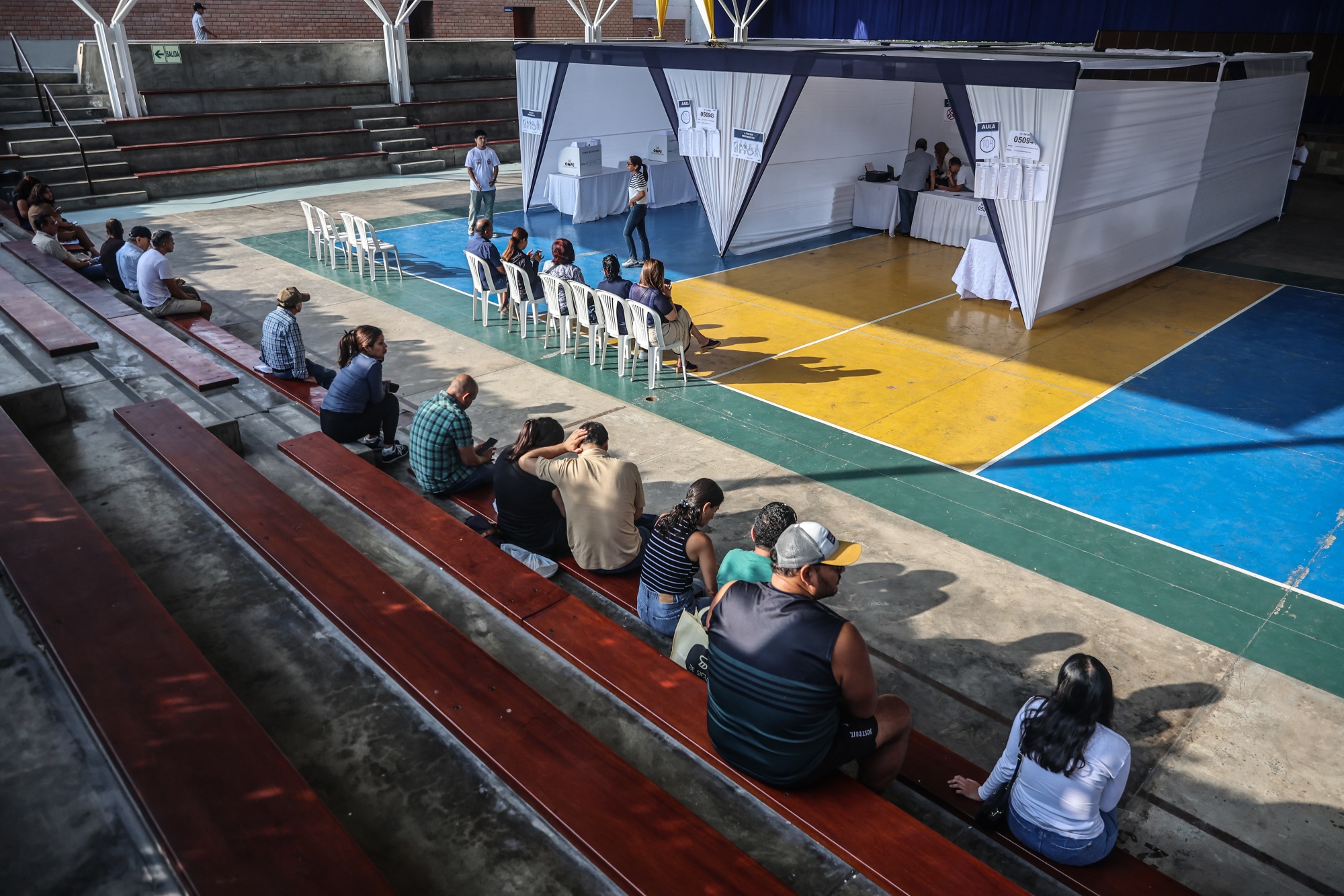 Voters wait in line to cast ballots at a polling station during the general elections in Lima, Peru, on Sunday, April 12, 2026. On Sunday, Peruvian voters will have to squint at giant ballot sheets listing dozens of candidates they've barely heard of, after an attempt to streamline the nations electoral system fell flat. Photographer: Sebastian Castaneda/Bloomberg