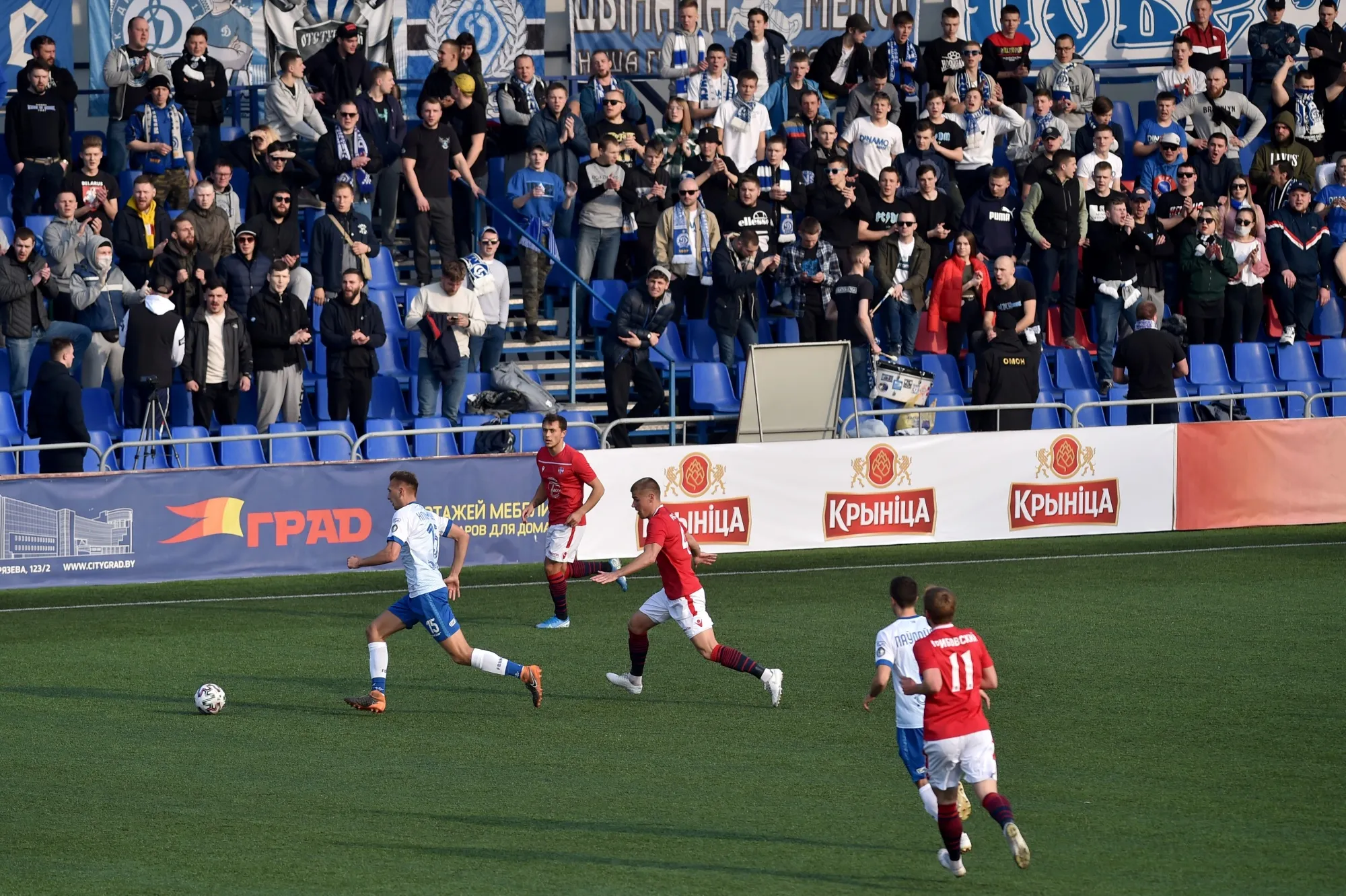 FC Minsk and FC Dinamo-Minsk team players vie for the ball during the Belarus Championship football match in Minsk on March 28.