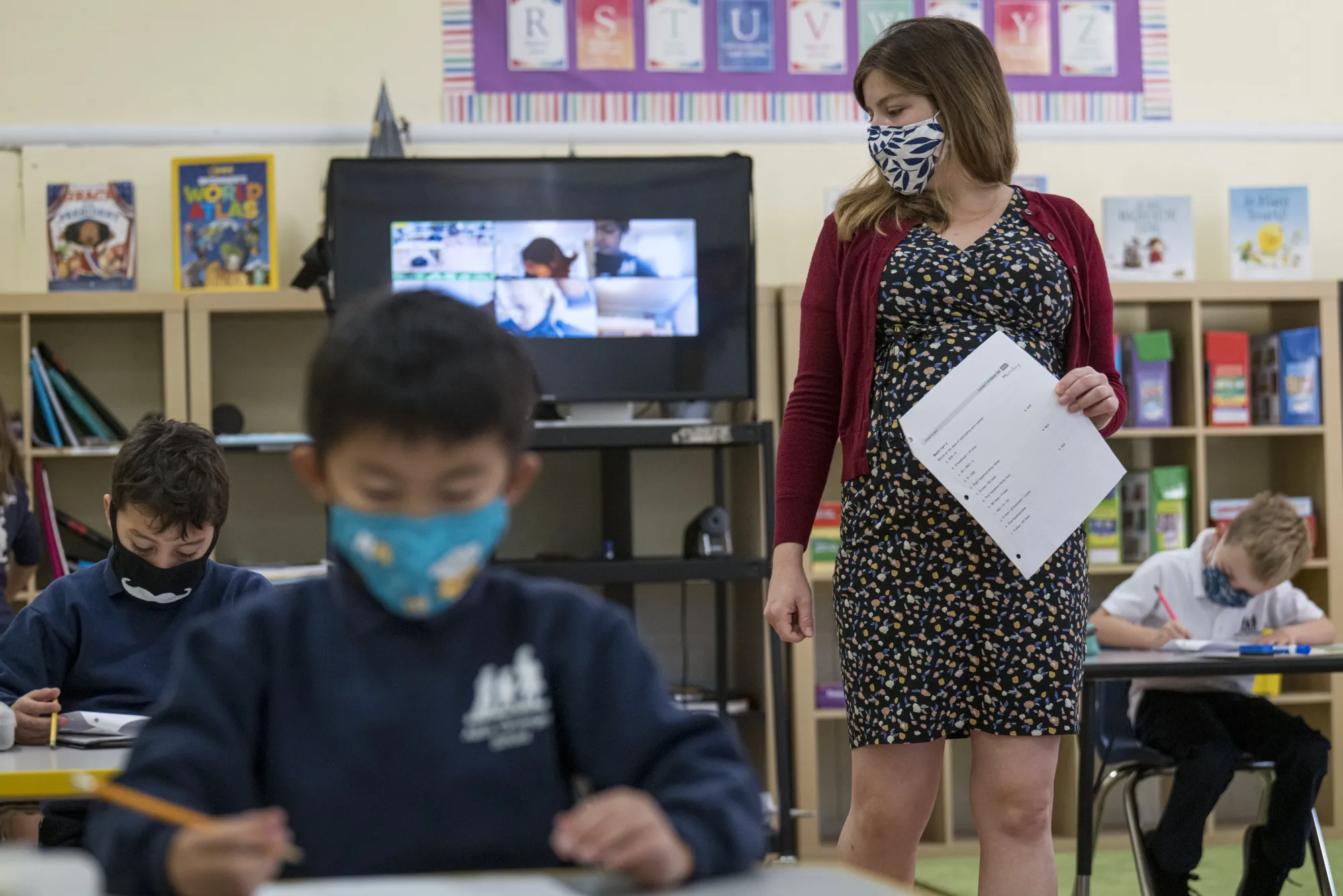A teacher walks around the classroom during a lesson at an elementary school in San Francisco,&nbsp;on&nbsp;Oct. 5, 2020.&nbsp;